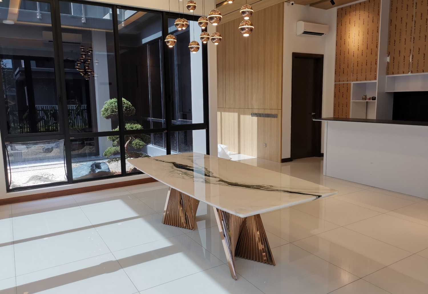 This table at a client’s home features a Panda White marble top on Moore 1 table base in Polished Copper Bronze finish